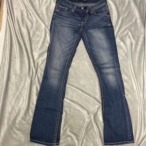 Express low rise barely boot cut jeans